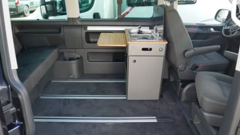 nice VW T6 Multivan with wide bed, pop-up roof, automatic