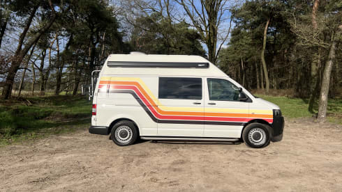 Retro Volkswagen Bus with bicycle carrier & awning