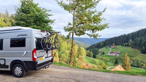 Fijnja – Luxury 4 pers. Pössl bus camper with sleeping lifting roof from 2019