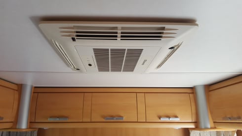 Comfortable camper with single beds and air conditioning