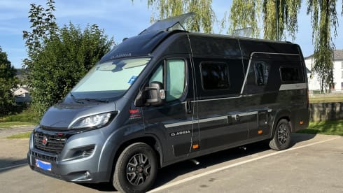 Adria Twin Supreme – Comfortable bus camper with automatic transmission + Switzerland vignette