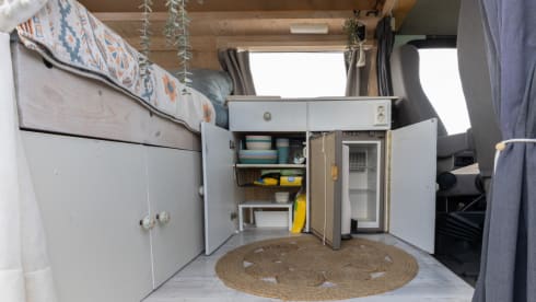 Retro turquoise camper, ready for a road trip. 