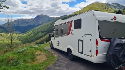 luxury camper including queen-size bed, pull-down bed and large garage and tow bar