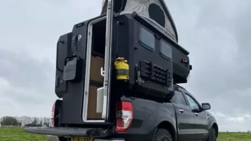 Inverness airport - tardis camper on a pick up truck