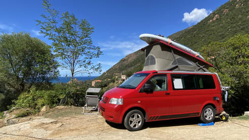 Red Volkswagen bus California T5
