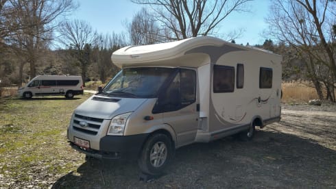 Comfortable motorhome with queen bed and electric bicycle carrier 