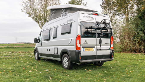 Fijnja – Luxury 4 pers. Pössl bus camper with sleeping lifting roof from 2019