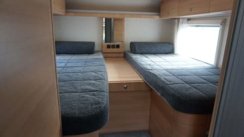 Nice compact 2 person camper with single beds.