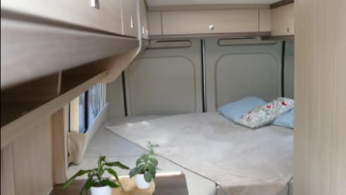 Bus camper with awning, private shower and toilet.