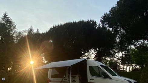 Home is where we park it! – Cool, fresh, self-sufficient 4 person bus camper.