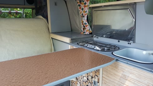 Cheerful Volkswagen camper van with lifting deck and pull-out bed for 2 people