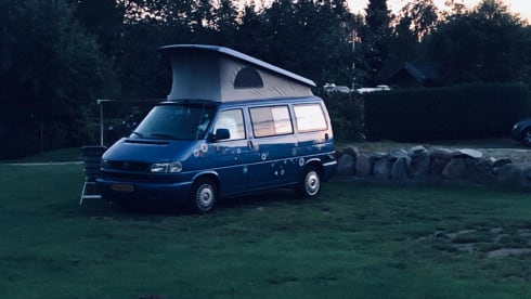 Cheerful Volkswagen camper van with lifting deck and pull-out bed for 2 people