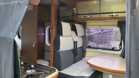 Neat camper van with length beds and solar panels
