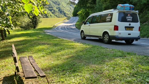 cool and cozy off grid camper van with lifting roof.