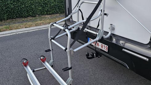 Luxury 4-person motorhome with bicycle rack and tow bar, model 2026