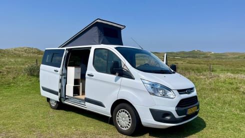 Cosy, compact off-grid Ford camper van