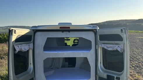 FOUR PEOPLE – Camper with two sleeping cabins for four people. 25% discount available.