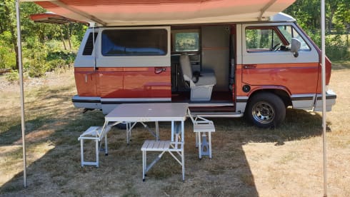 Original retro Volkswagen T3 Dehler with complete camping equipment.