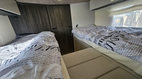 Luxury 4-person motorhome with bicycle rack and tow bar, model 2026