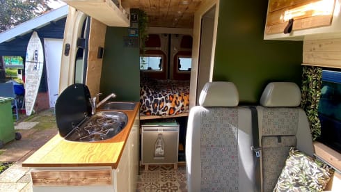 Home is where we park it! – Cool, fresh, self-sufficient 4 person bus camper.