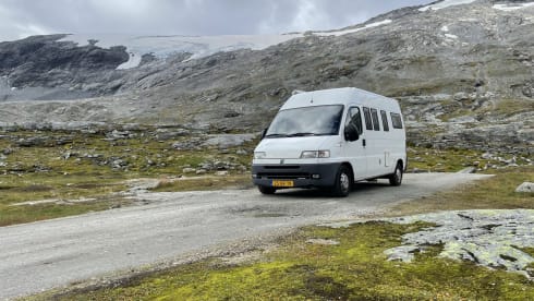 On an adventure with a reliable bus camper.