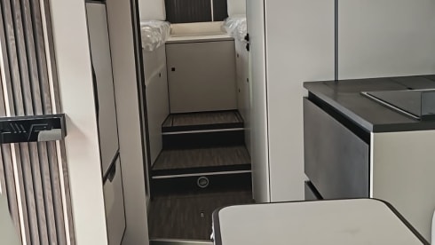 Luxury 4-person motorhome with bicycle rack and tow bar, model 2026