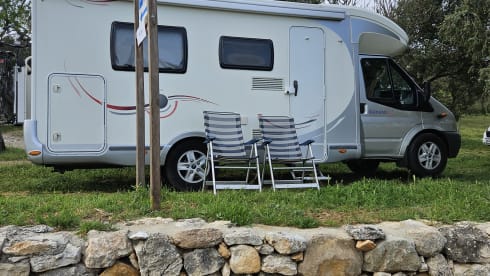 Comfortable motorhome with queen bed and electric bicycle carrier 