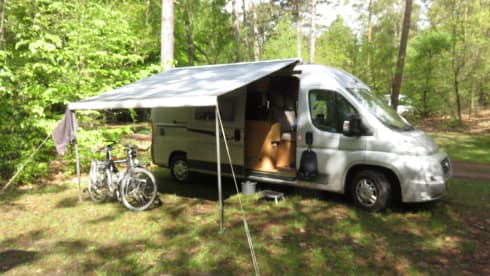 2 person bus camper with fixed bed and sanitary facilities