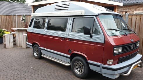 Original retro Volkswagen T3 Dehler with complete camping equipment.