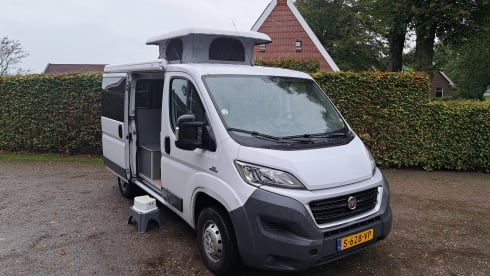 Peugeot boxer with fixed bed and large lifting roof