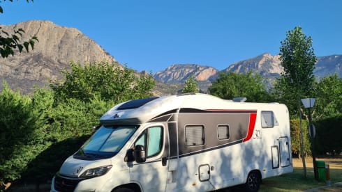 luxury camper including queen-size bed, pull-down bed and large garage and tow bar