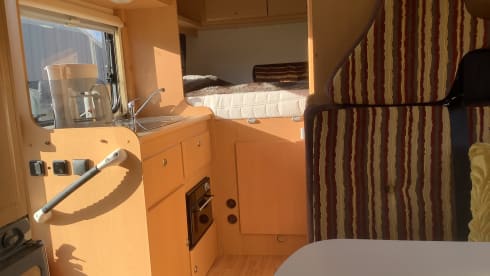 Semi-integrated camper