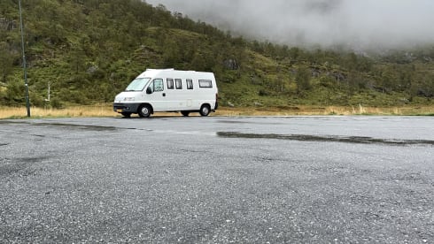 On an adventure with a reliable bus camper.