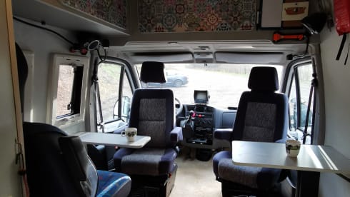 On an adventure with a reliable bus camper.