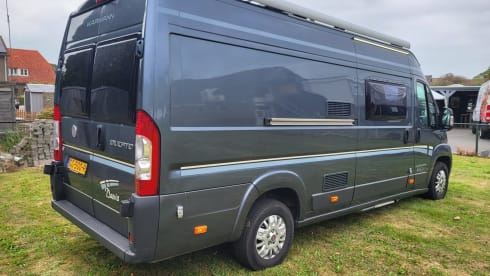 Neat camper van with length beds and solar panels
