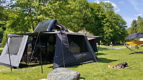 The AdventuresVan β Off-grid custom-made campervan with roof tent