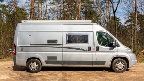 2 person bus camper with fixed bed and sanitary facilities
