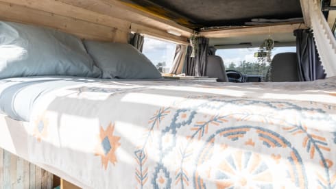 Retro turquoise camper, ready for a road trip. 