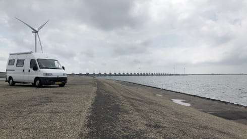 On an adventure with a reliable bus camper.