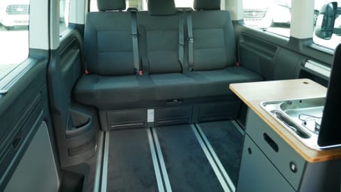 nice VW T6 Multivan with wide bed, pop-up roof, automatic