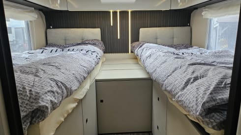 Luxury 4-person motorhome with bicycle rack and tow bar, model 2026