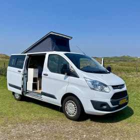 Cosy, compact off-grid Ford camper van