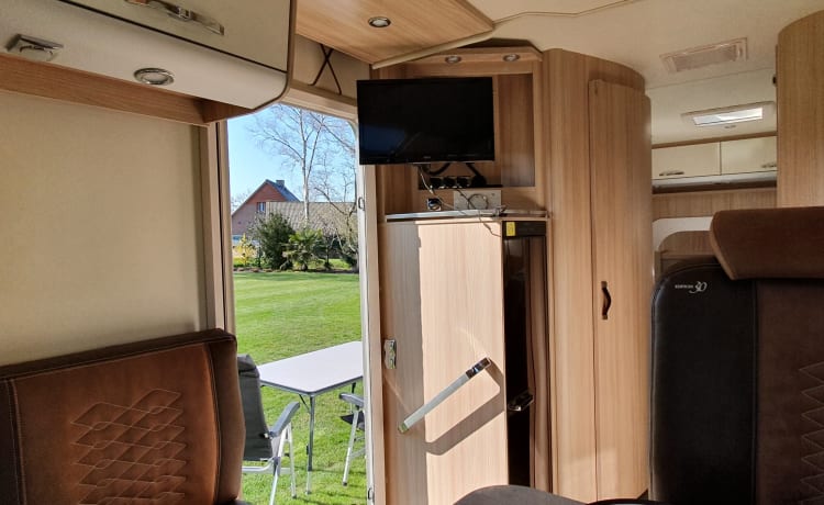 luxury camper including queen-size bed, pull-down bed and large garage and tow bar