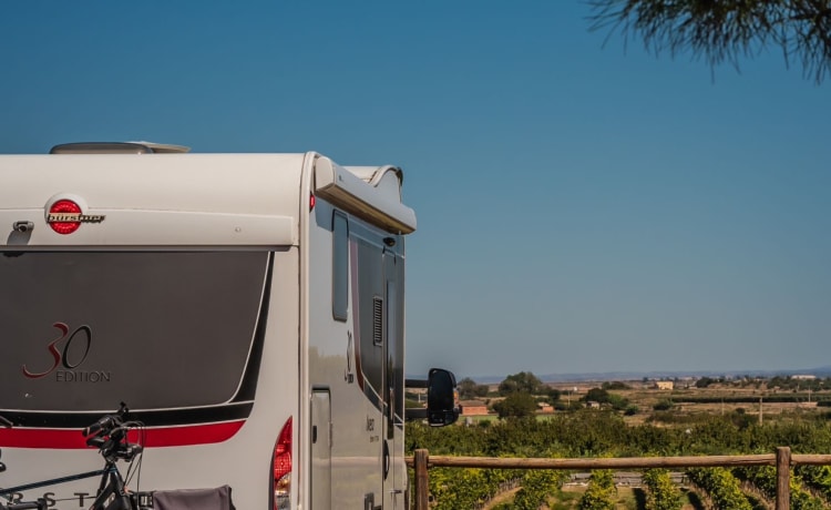 luxury camper including queen-size bed, pull-down bed and large garage and tow bar