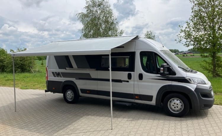 Heunie 1 – Beau camping-car bus avec 2 lits longitudinaux