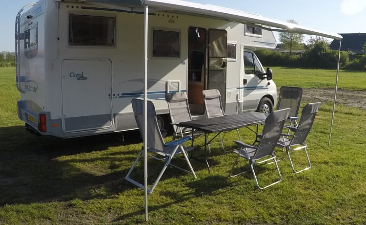 5 person Adria Mobil alcove camper > (electric) bicycles in garage