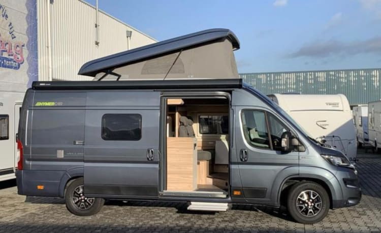 Jo'Berg – Camper autobus Hymer Yellowstone (con tetto sollevabile) del 2019