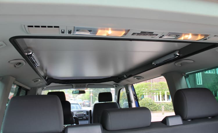 powerful VW T5 Multivan camper van with spacious Reimo pop-up roof