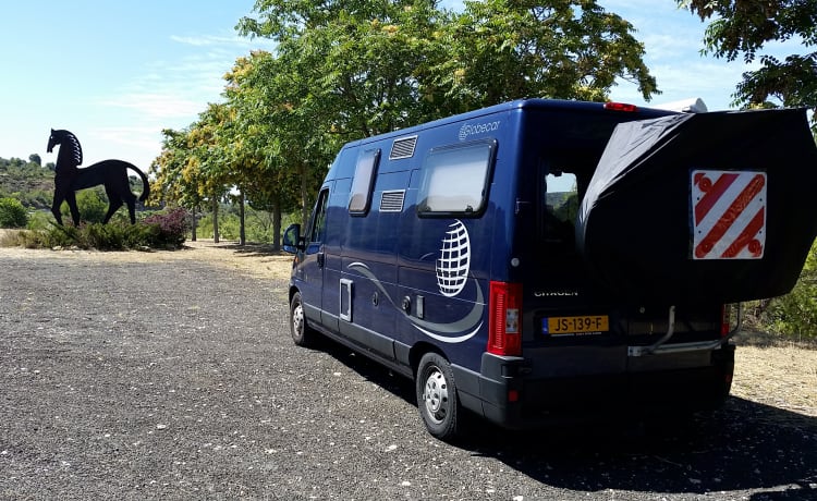 Compact yet spacious factory camper with cozy round seat and winter tires