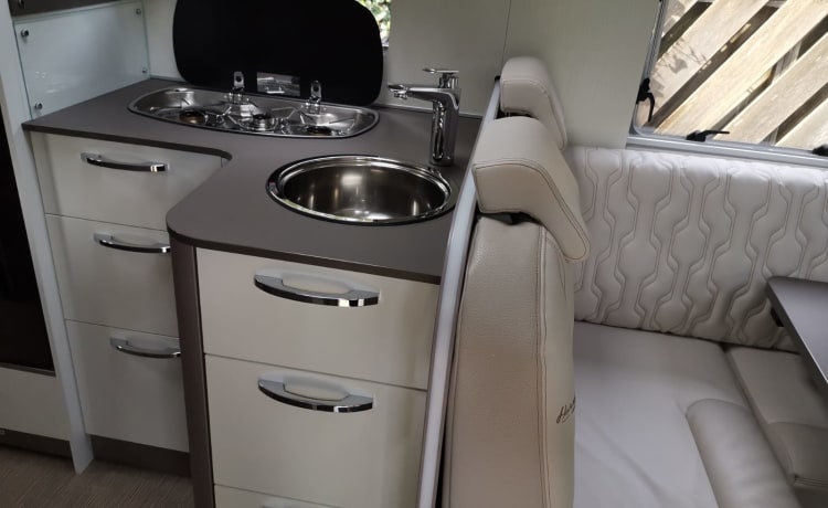 Luxury semi-integrated Burstner camper single beds & pull-down bed